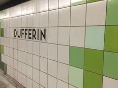 Interior of Dufferin TTC subway station with distinctive green wall tiles in Toronto