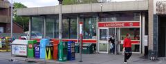 Exterior view of Toronto Transit Commission's Lansdowne station with a streetcar in front