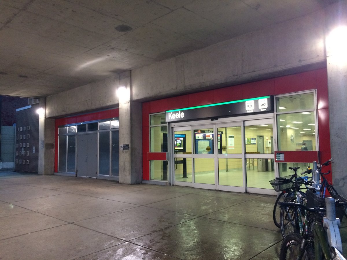 Main entrance to Keele TTC subway station in Toronto Ontario with stairs and glass canopy
