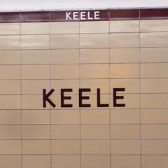 Tiled platform wall at Keele subway station in Toronto with distinctive mosaic art