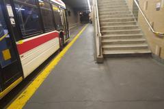 Bus terminal bay at Warden TTC station with stairway to waiting area