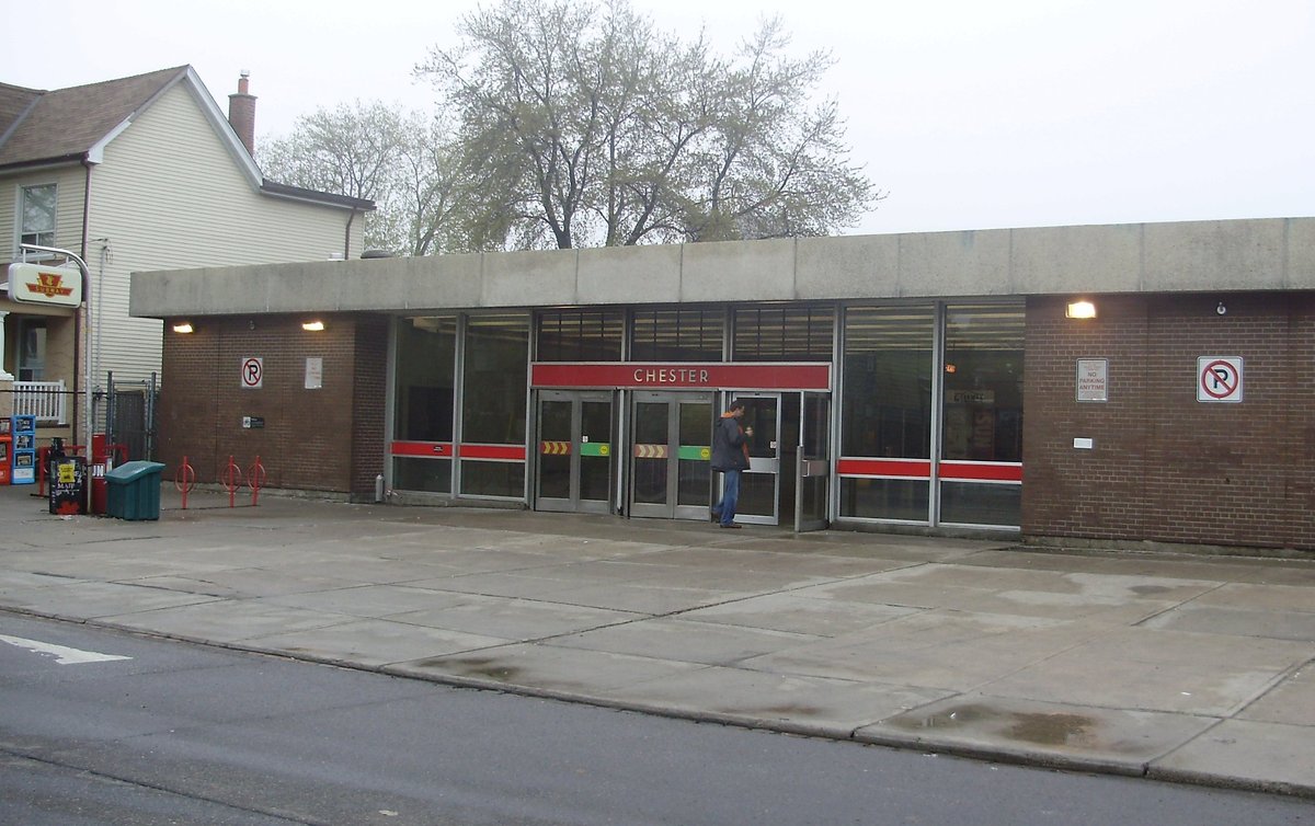 Main entrance of Chester Station in Toronto with glass and metal architecture