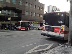 Two TTC buses outside Sherbourne Subway station in Toronto
