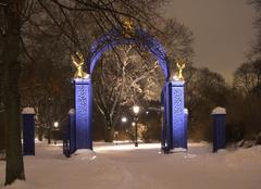 Blue Gate entrance in Oslo, Norway during winter with snow covered trees and pathway