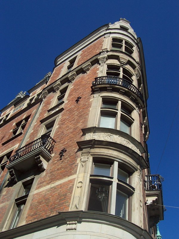 Street view of Östermalm district in Stockholm Sweden with buildings and cars in May 2005
