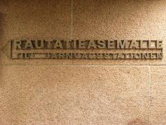 Sign in Helsinki, Finland pointing to the railway station