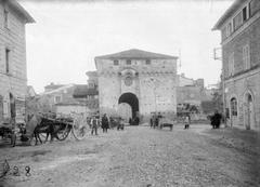 Historical photograph of Biblioteca Federiciana entrance with Porta Malatestiana in Fano