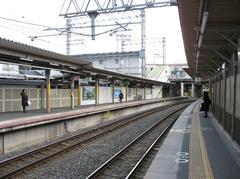 JR Tofukuji Station platform with overhead canopy and tracks