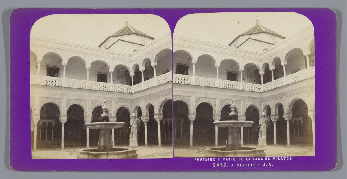 Courtyard with a fountain in Casa de Pilatos in Seville, historic Spanish architecture