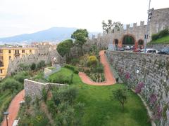 Wall of Castello San Giorgio descending to the town of La Spezia in Liguria, Italy