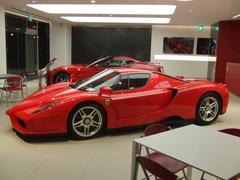 Red Ferrari Enzo sports car displayed at CORNES Shinsaibashi showroom