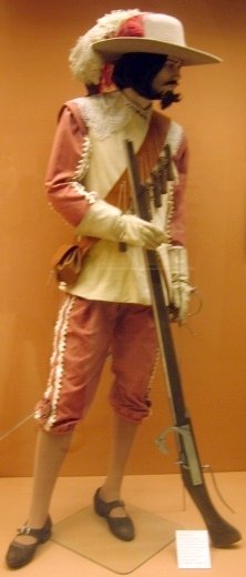 Spanish arquebusier from the 17th century in traditional armor and holding an arquebus