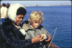 People engaging in various activities on McCorkle Fishing Pier at Castle Island Boston Harbor recreation area