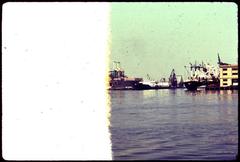 Castle Island with fishing pier and ship Westward S.E.A. school ship engaged in environmental research