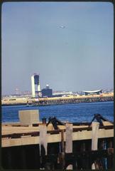 Castle Island and McCorkle Fishing Pier in Boston Harbor recreation area with a view towards Logan Airport