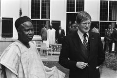 President Ahmadu Ahidjo of Cameroon with Minister Wiegel at the Catshuis in The Hague during state visit to the Netherlands in 1979