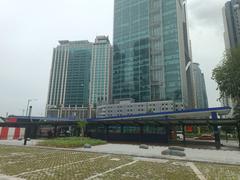 Ampang Park LRT Station exterior with modern architecture and clear blue sky