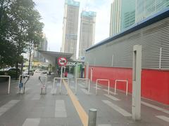 Ampang Park LRT Station exterior with modern architecture under a clear sky