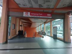 Ampang Park LRT Station entrance with escalator and modern architecture in Kuala Lumpur