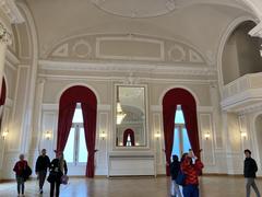 Large interior hall of Cercle Cité with seating and lighting fixtures