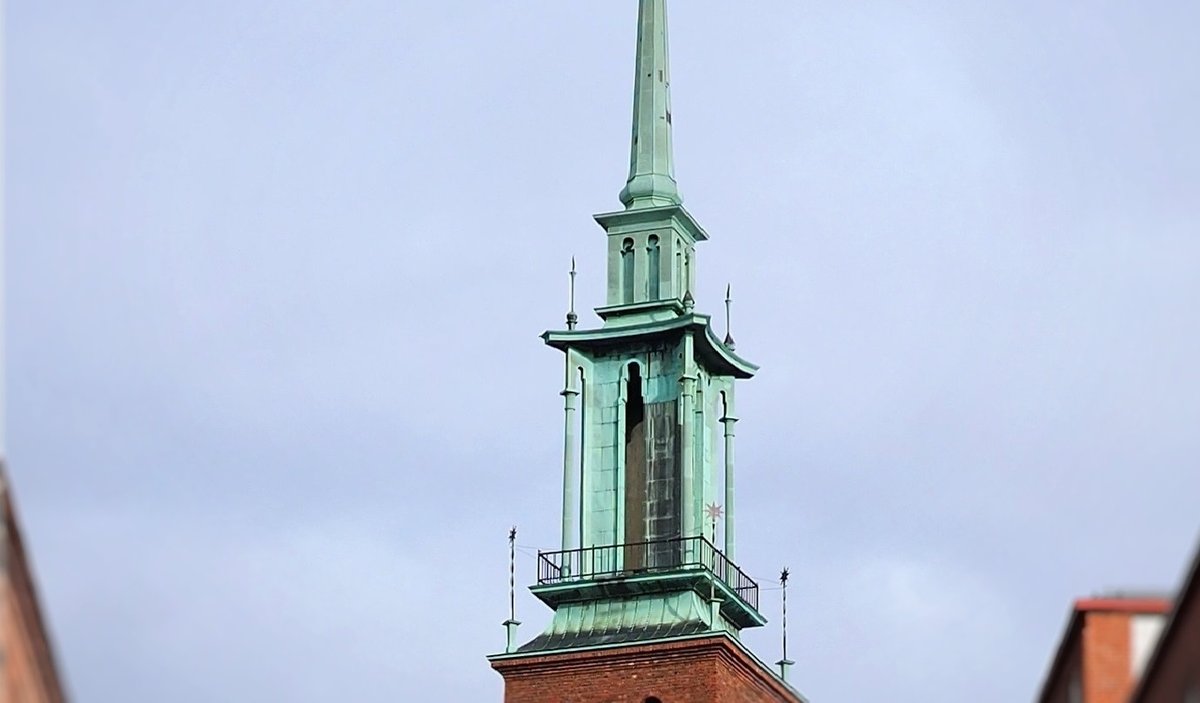 Top spire of Kristuskyrkan bell tower in central Helsinki