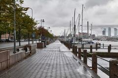 Marina Halkolaituri in Helsinki with boats docked along the pier and a calm sea under blue sky