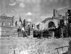 Commemorative ceremony at the entrance of Sadi Carnot air raid shelter in Brest with French and British military officers and DP members wearing armbands and Adrian helmets