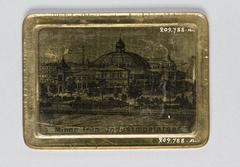 Portrait of a woman in outerwear and hat mounted on a metal plate with a photograph of the Industripalatset on the reverse, labeled 'Minne av Industripalatset'