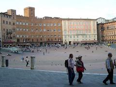 Siena Piazza del Campo panoramic view with historic buildings and crowds