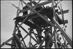 Spire of Oscarskyrkan being repaired in 1955 showing scaffolding and construction work