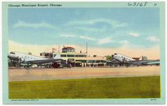Aerial view of Chicago Municipal Airport showing runways, surrounding buildings, and landscape