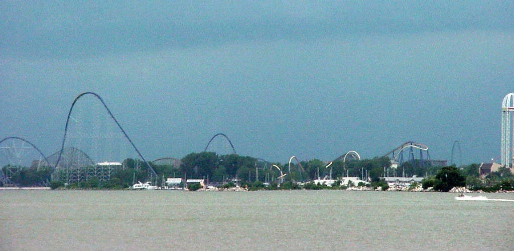 View of Cedar Point amusement park in Sandusky, Ohio, featuring several roller coasters and rides along the shoreline