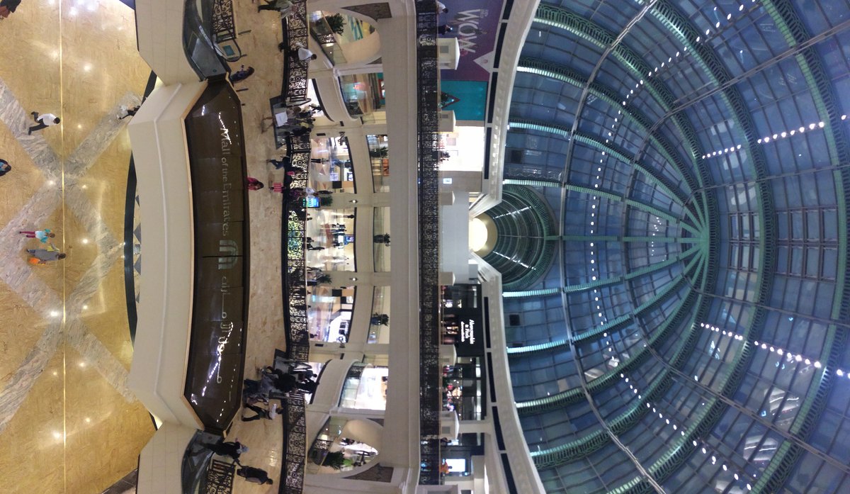 Mall of Emirates exterior with snow-covered entrance and trees
