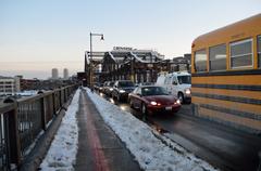 Charlestown Bridge over Boston Harbor with city skyline in the background on a clear day