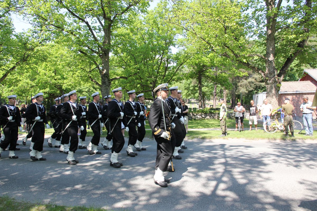 School of naval warfare troops marching during Finnish military Flag Day parade on Raaseporintie road in Tammisaari 2013