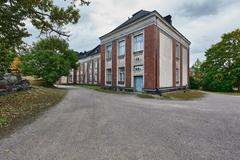 Naval Academy building on Suomenlinna island surrounded by water and greenery
