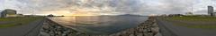 Scenic coastal view of Reykjavik with ocean and city skyline