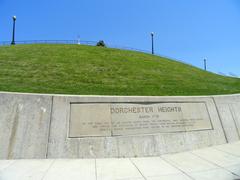 Dorchester Heights Monument park entrance with stone monument and trees in Boston