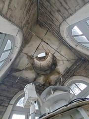 View of marble ceiling slabs and spire tiedown rods under the lantern