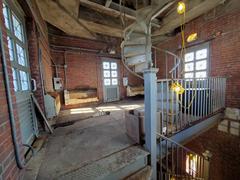 Partial observatory tower level with spiral staircase and three sets of windows