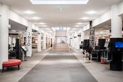 Interior view of Stockholm University Library with bookshelves and reading area