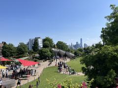 People enjoying warm weather at Little Island park in New York City