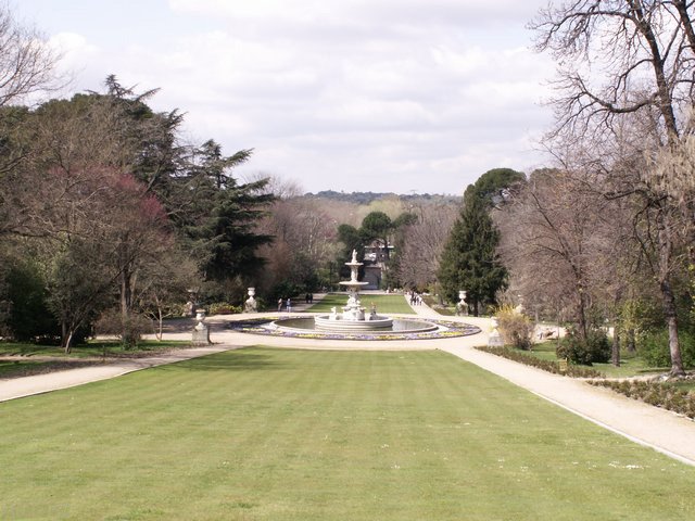 Beautiful Campo del Moro gardens with green lawns and trees near the Royal Palace in Madrid, Spain