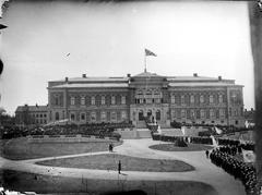 Grand opening ceremony of Universitetshuset, Uppsala in May 1887 with a large crowd gathered outside the building