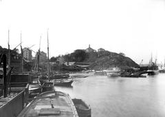 View of Tegelviken in Stockholm facing west with Ersta Chapel on the hill in the background