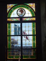 Historic Castillo de Chapultepec with flags and scenic surrounding