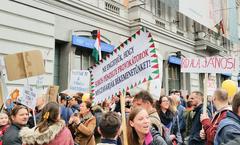 Demonstration of the Hungarian Two-tailed Dog Party in Budapest with large crowd and colorful banners