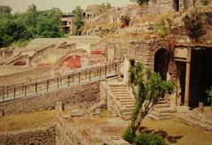 View of ancient ruins in Pompeii with Mount Vesuvius in the background