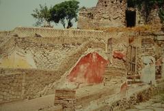 Panoramic view of the ancient ruins of Pompeii with Mount Vesuvius in the background