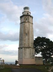 Bagacay Point Lighthouse in Liloan, Cebu, Philippines on a rocky coastline